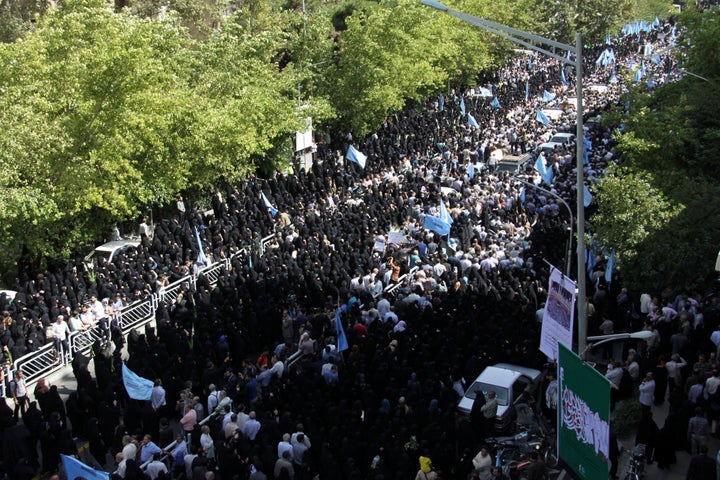 Iranians mourn during a funeral procession for some of the Iranian pilgrims who were killed in a stampede at the annual hajj.