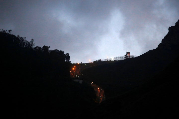 The border fence which separates Morocco and Spain's north African enclave of Ceuta is seen as it is illuminated, Spain, December 11, 2016.