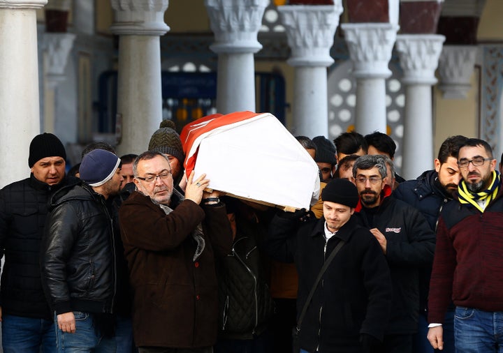 Relatives carry the coffin of Ayhan Arik, a victim of an attack by a gunman at Reina nightclub, during his funeral in Istanbul, Turkey, January 1, 2017.