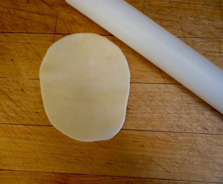 <p>8-cm (3-in) circles of dough were elongated with a little rolling pin</p>