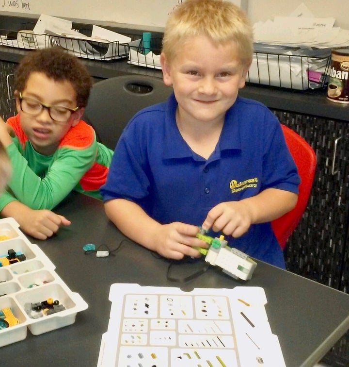 Danny, 7, learns to program a robot using a Lego Wedo Kit at The Cornerstone School in Ocala, FL. 