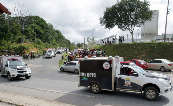 Vans of the Legal Medicine Institute (IML) carrying bodies of inmates killed during a riot, leave the Anisio Jobim Penitentiary Complex (Compaj) in Manaus, Amazonia, Brazil.