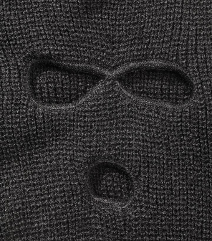 The attacker obscured his facial features with a balaclava (file picture)