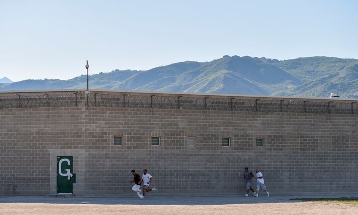 Inmates run the yard during the Addict II Athlete program at the Utah State Prison - Promontory Facility on June 19, 2015 in Draper, UT.