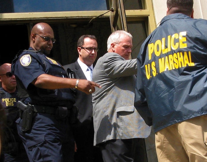 Jared Fogle (C) is led from federal court in Indianapolis, Indiana August 19, 2015.