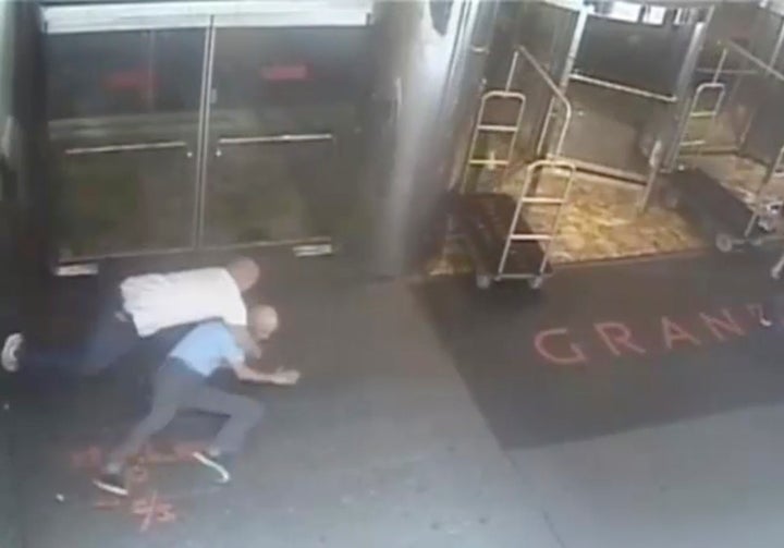 Ex-tennis star James Blake is shown tackled by a NYPD officer James Frascatore (L) in front of the Grand Hyatt hotel in New York on September 9, 2015 in this still image from a security camera video released on September 11, 2015. The New York City Police Department on Friday released a security camera video showing Blake being tackled, thrown to the ground and handcuffed by an undercover officer in a now infamous case of mistaken identity. REUTERS/NYPD/Handout 