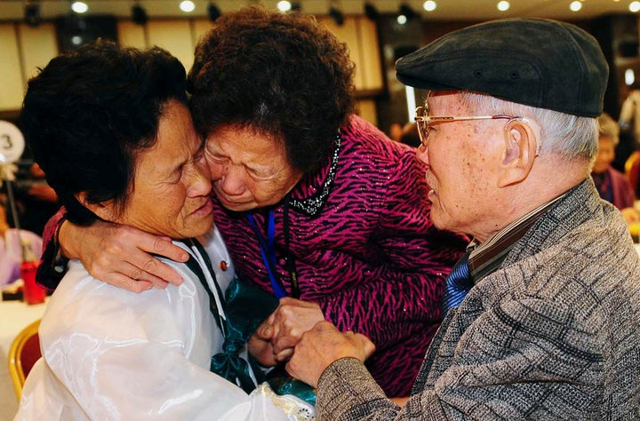 South Korean Kim Sung-bok (R), 90, with an unidentified South Korean family member, meets his daughter Kim Hee-sook (L), 61, during an inter-Korean temporary family reunion at Mount Kumgang resort in North Korea Nov. 3, 2010.