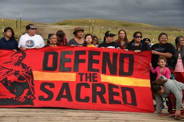 <p>Native Americans protest the oil pipeline that is designated to cross the Missouri River in North Dakota, and disturb a sacred burial site for Native Americans.</p>