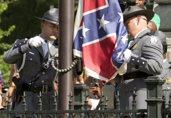 The Confederate battle flag is permanently removed from the South Carolina statehouse grounds during a ceremony in Columbia, South Carolina, U.S. on July, 10, 2015. REUTERS/Jason Miczek/File Photo