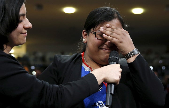 Asking a question to U.S. President Barack Obama, Maria Munir, who said she was coming out to him as a non-binary person, breaks down during a town hall held by Obama at the Royal Agricultural Halls in London, Britain April 23, 2016.REUTERS/Kevin Lamarque