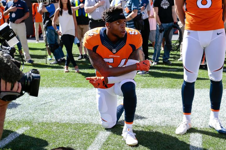 Sep 18, 2016; Denver, CO, USA; Denver Broncos inside linebacker Brandon Marshall (54) kneels during the National Anthem prior to the game against the Indianapolis Colts at Sports Authority Field at Mile High. Mandatory Credit: Isaiah J. Downing-USA TODAY Sports