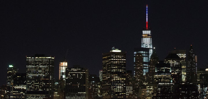 One World Trade Center's spire is shown lit in French flags colors of white, blue and red in solidarity with France after ton