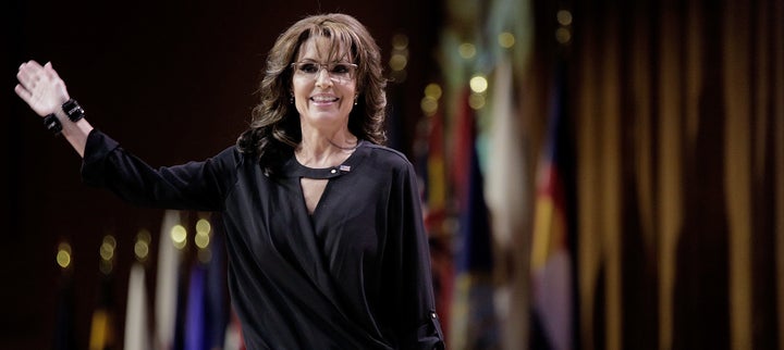 Sarah Palin waves as she leaves the stage during the 41st annual Conservative Political Action Conference in National Harbor, Maryland.