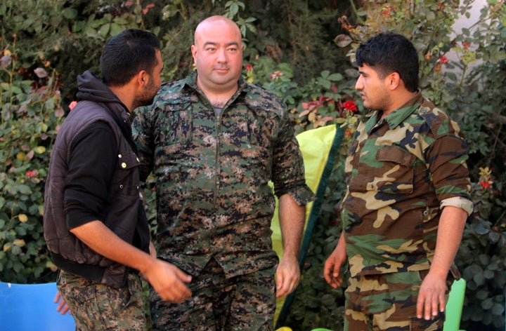 Brian Wilson (C), who said he is a U.S. citizen and a former soldier from Ohio, and who has joined the Kurdish People's Protection Units (YPG).