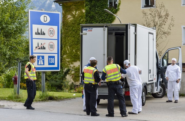 German police officers check a refrigerated truck at the check point during a border control on the border crossing between A