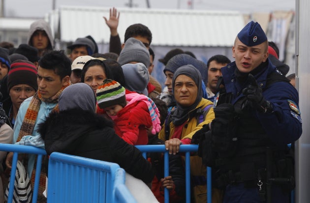 Hungarian border police arrive at the transit camp on the Macedonia-Greece border near Gevgelija, to...