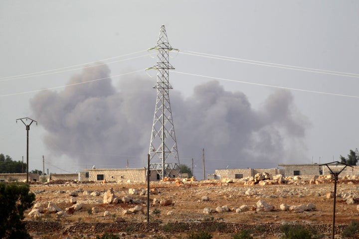 Smoke rises after what activists said were Russian airstrikes in the southern Idlib province, Syria October 2, 2015.