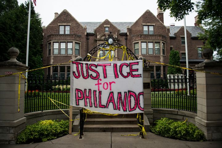 A sign reading, 'Justice for Philando,' and police tape are draped over the entrance of the Governor's Mansion following the police shooting death of a black man on July 7, 2016 in St. Paul, Minnesota.