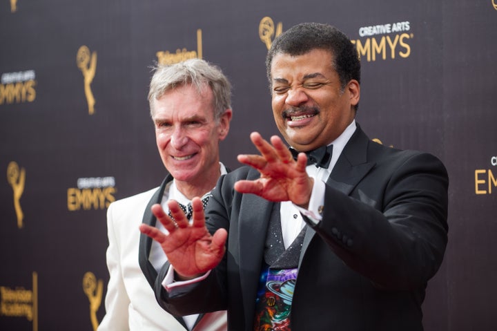 Bill Nye (L) and Neil deGrasse Tyson arrive at the Creative Arts Emmy Awards at Microsoft Theater on September 10, 2016 in Lo