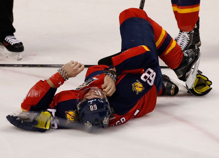 Florida Panthers forward Jaromir Jagr is seen rolling on the ice after having four teeth knocked out by an opponent's high stick Tuesday.