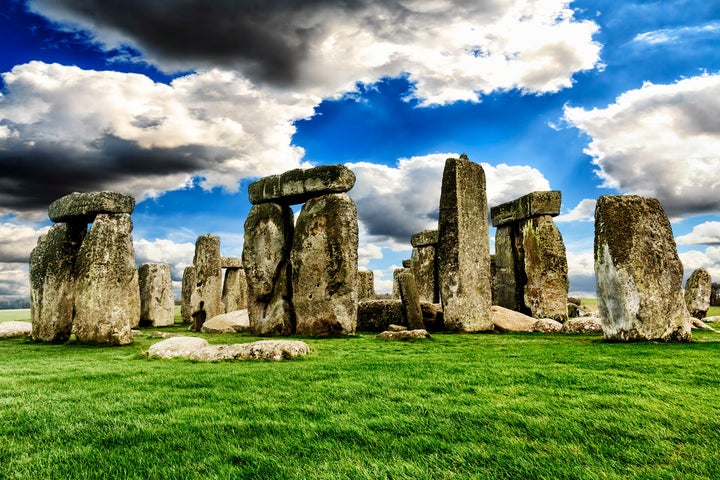 Archaeologists say they have discovered the cremated remains of 14 women, believed to have been of high status, buried beneath Stonehenge.