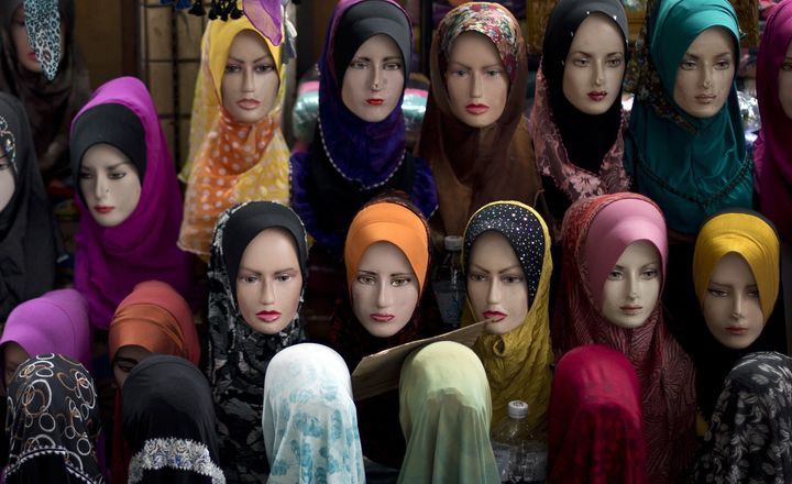 Mannequins with the latest styles of headscarfs or 'hijab' on display outside a shop in downtown Kuala Lumpur.