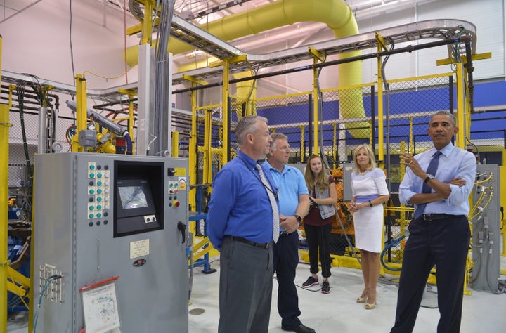 US President Barack Obama and Jill Biden (2nd R), the wife of Vice President Joe Biden, tour the Michigan Technical Education
