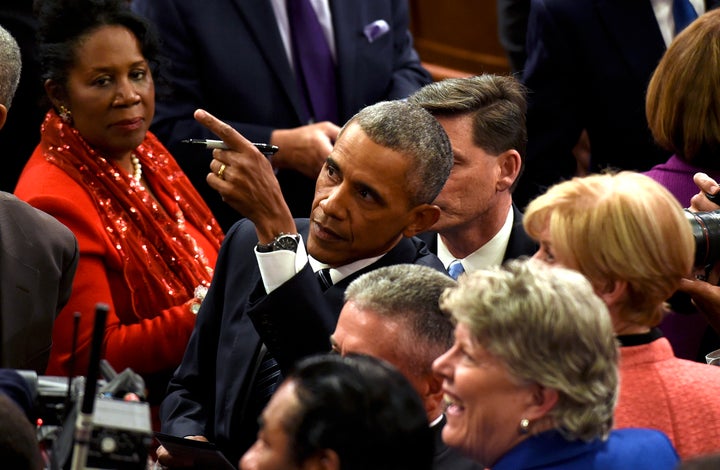 Rep. Sheila Jackson Lee just got President Obama's autograph because of her excellent seat.