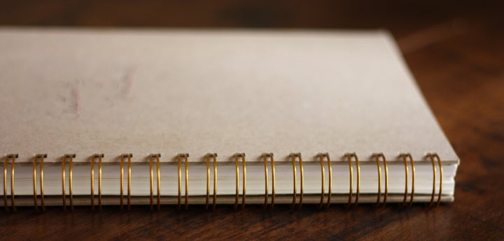 Wire binding is essential to enable the book to fold completely to one side and block out everything else — the equivalent of