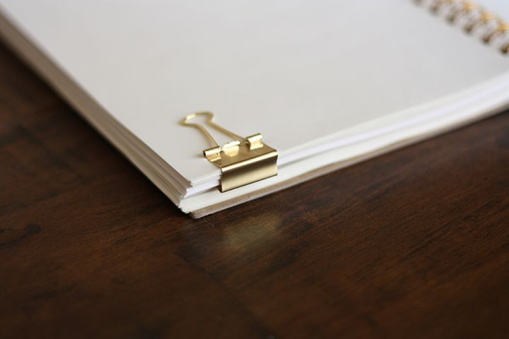 The brass clip acts a a toggle between the two sections of the datebook. Only the pages you need are accessible.