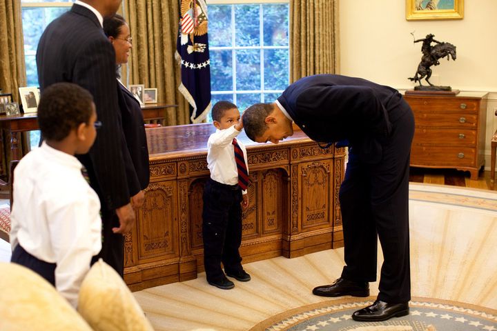 Five-year-old Jacob Philadelphia touches Obama's hair to see if it feels like his.