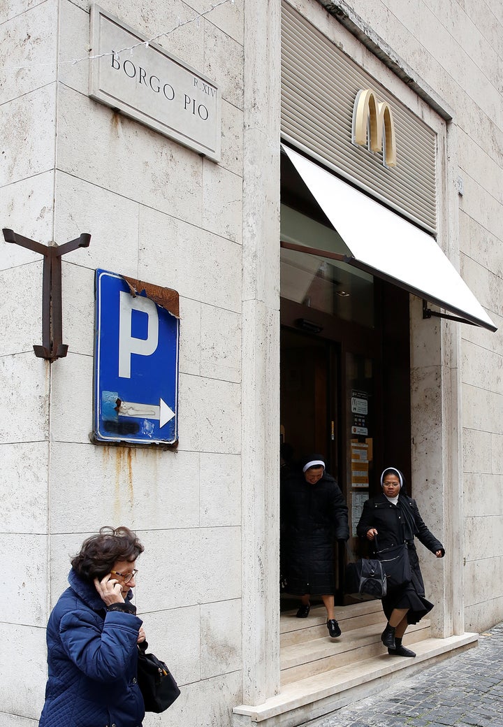 Two nuns leave a McDonald's restaurant at Borgo Pio in Rome, Italy in front of Vatican City's St. Peter's Square January 3, 2017.