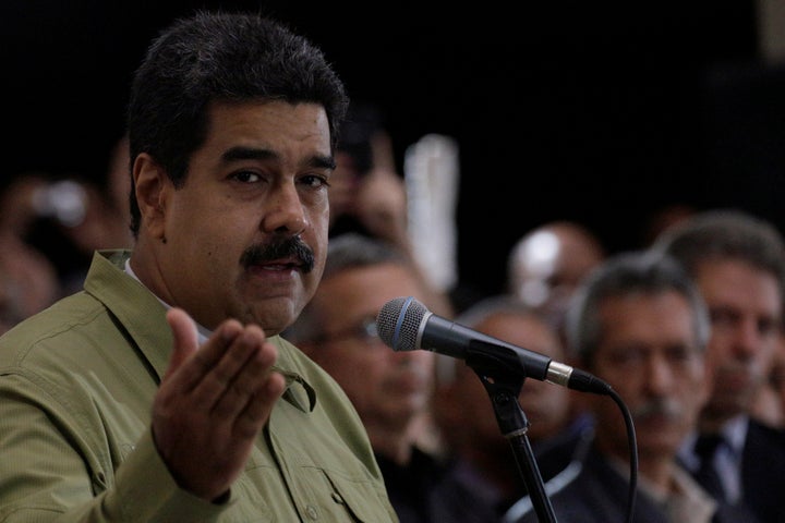 Venezuela's President Nicolas Maduro (L) speaks during a homage ceremony of late former Cuban leader Fidel Castro at the 4F military fort in Caracas, Venezuela November 26, 2016.