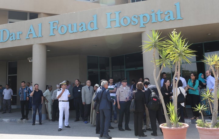 Police and Mexican embassy members stand outside Dar Al Fouad Hospital, where injured tourists who were mistakenly targeted in a military operation "chasing terrorist elements" are recovering, as Claudia Ruiz Massieu, Mexico's Minister of Foreign Affairs, came to visit them in Cairo, Egypt, September 16, 2015.