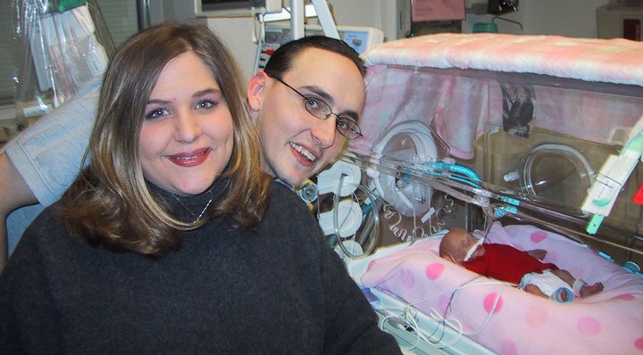 Tammy, Eric and Zoe in their first family photo. Baby Zoe spent five months in the NICU; when she was able to go home at five