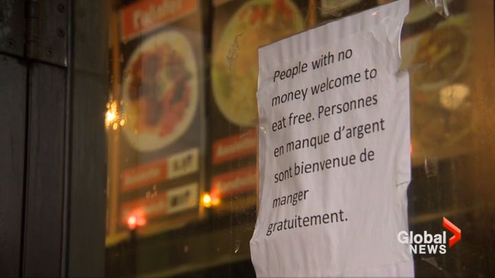 The sign outside Marché Ferdous, written in English and French, offers free food to those with no money.