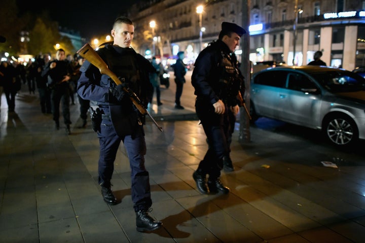 French police patrol at the Place de la République in Paris on Sunday, Nov. 15, 2015.