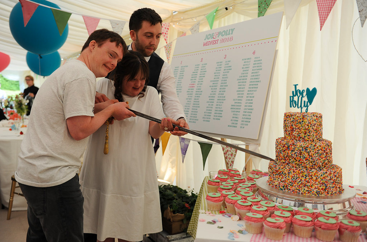 The couple cutting the wedding cake. 