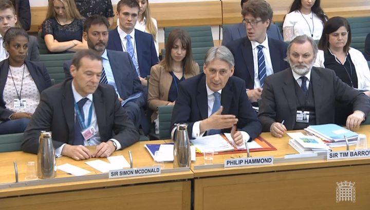 Sir Tim Barrow (right) gives evidence to the Foreign Affairs Committee at the House of Commons