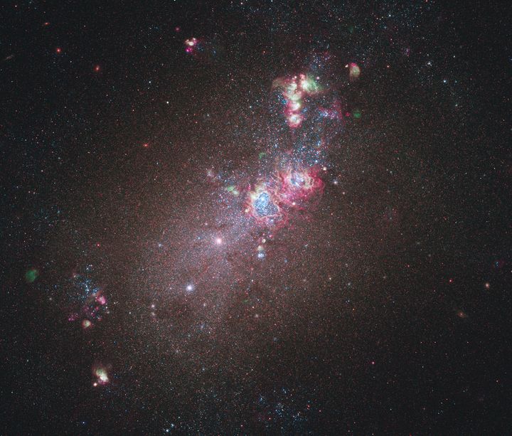 This full-field image of the nearby dwarf galaxy NGC 4214 taken with NASA's Hubble Space Telescope is shown as released by NASA May 12, 2011.