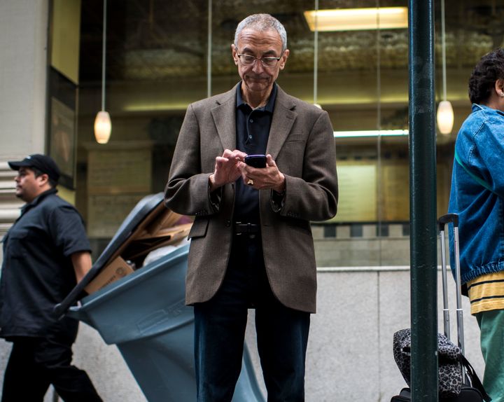 John Podesta, Clinton's campaign chairman, using his smartphone in June 2015
