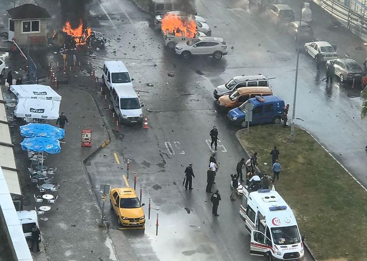 Cars burn in the street at the site of the explosion
