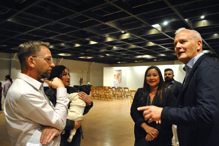 Jason Cook, RaiseAChild Parent Advocate Manager (left) and Rich Valenza (right) at RaiseAChild’s December 2016 Event in Long