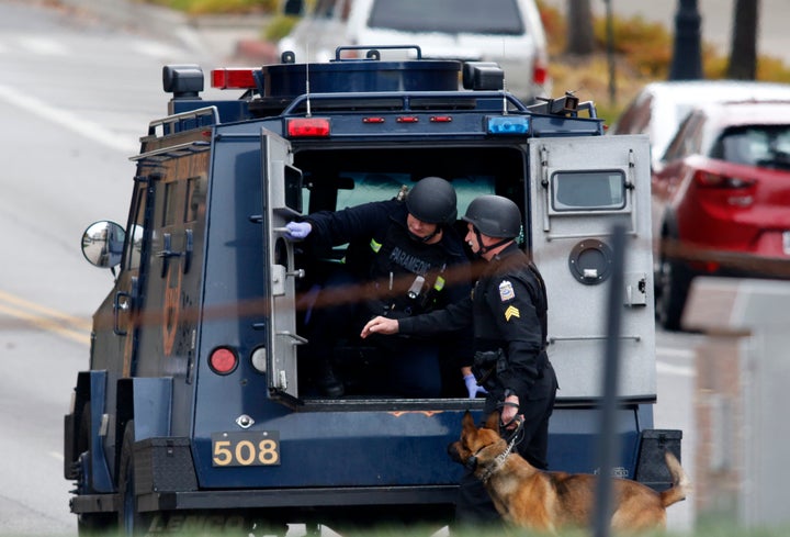 Law enforcement officials are seen outside of a parking garage on the campus of Ohio State University as they respond to an a