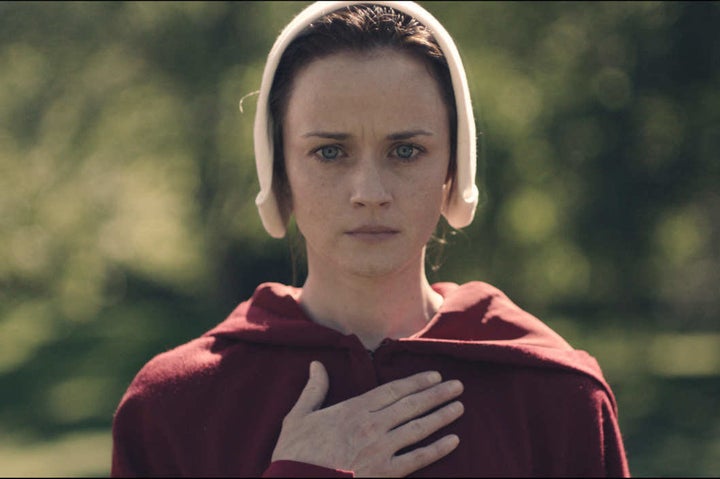 Alexis Bledel appears as a Handmaid in Hulu's adaption of <em>The Handmaid's Tale.</em>