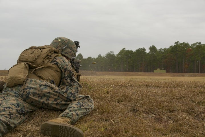 A Marine with the 1st Battalion, 8th Marine Regiment engages a target during a fire and maneuver range at Camp Lejeune, North Carolina, on Nov. 29, 2016. Three women are scheduled to join the unit as the Marines' first female infantrymen on Thursday.