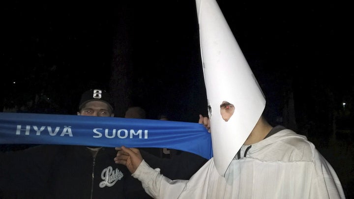 A demonstrator wearing a Ku Klux Klan outfit attends a protest against refugees in Lahti, Finland September 24, 2015.