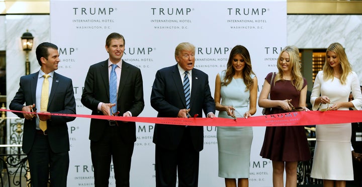 Donald Trump Jr., Eric Trump, Donald Trump, wife Melania, and daughters Tiffany and Ivanka Trump attend a ribbon-cutting at Trump International Hotel in Washington, D.C., in October.