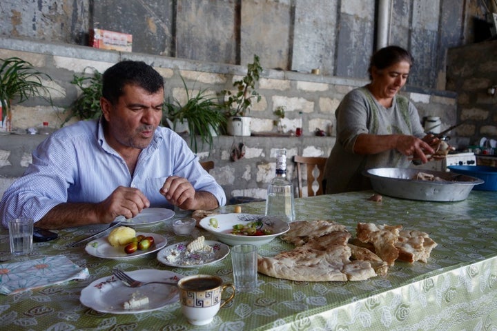 Villagers invite me in for a meal in Nagorno-Karabakh. 