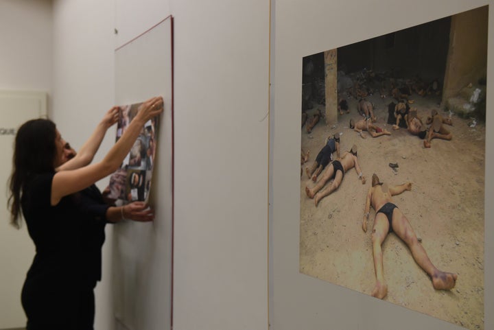 Photographs documenting Assad's torture of Syrians have been displayed across the world. They are seen here in Geneva, Switzerland, last March.